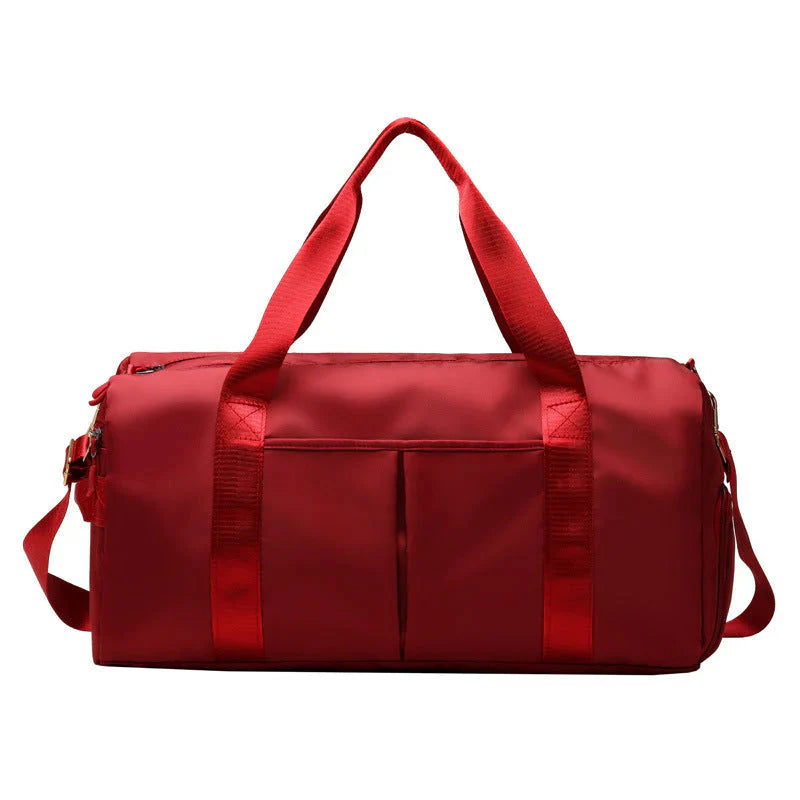 Waterproof Fitness Sports Travel Duffel Bag in vibrant red color with spacious compartments and durable straps.